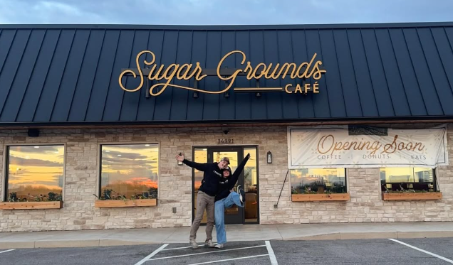 Lydia and Conrad outside the Sugar Grounds Cafe storefront